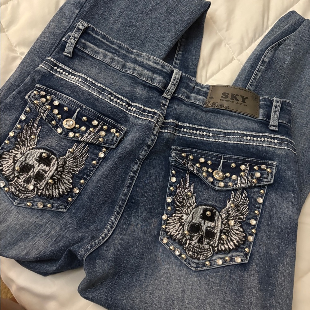 Sky Denim Jeans with Skull and Wing Design